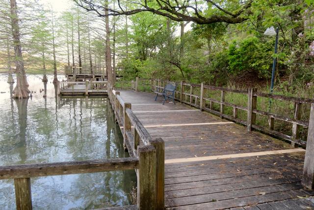 Long timber boardwalk deck running beside water